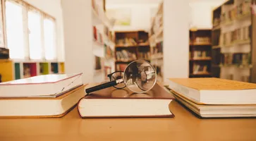 https://ognikubani.ru/wp-content/uploads/2023/01/book-in-library-with-old-open-textbook-stack-piles-of-literature-text-archive-on-reading-desk