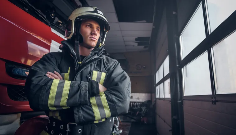 https://ognikubani.ru/wp-content/uploads/2023/01/a-brave-fireman-wearing-protective-uniform-standing-next-to-a-fire-engine-in-a-garage-of-a-fire-department-crossed-arms-and-looking-sideways