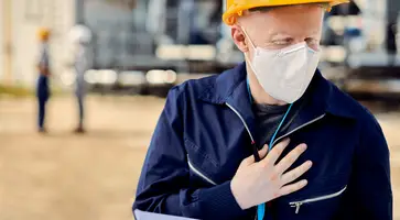 https://ognikubani.ru/wp-content/uploads/2023/03/albino-construction-worker-with-face-mask-holding-his-chest-in-pain-while-working-outdoors