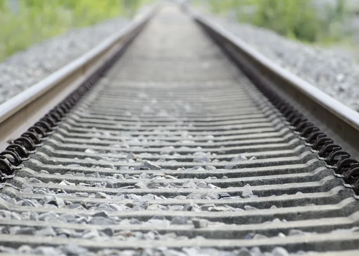 high-angle-shot-old-rusty-railway-tracks-covered-small-stones