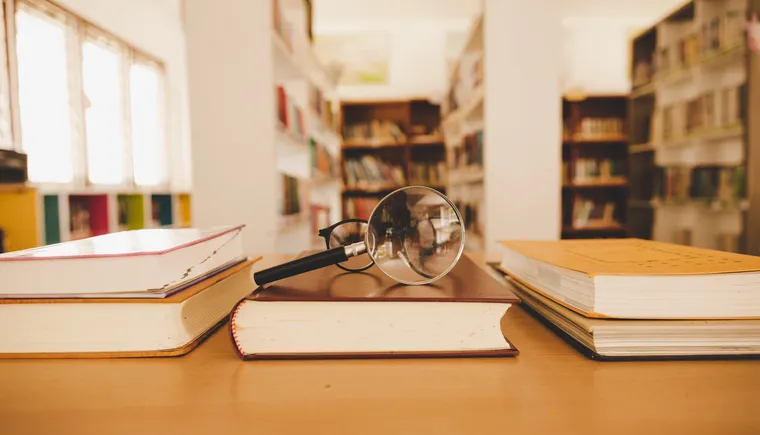 https://ognikubani.ru/wp-content/uploads/2023/01/book-in-library-with-old-open-textbook-stack-piles-of-literature-text-archive-on-reading-desk