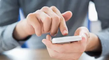 https://ognikubani.ru/wp-content/uploads/2023/03/close-up-of-male-hands-touching-smartphone-screen
