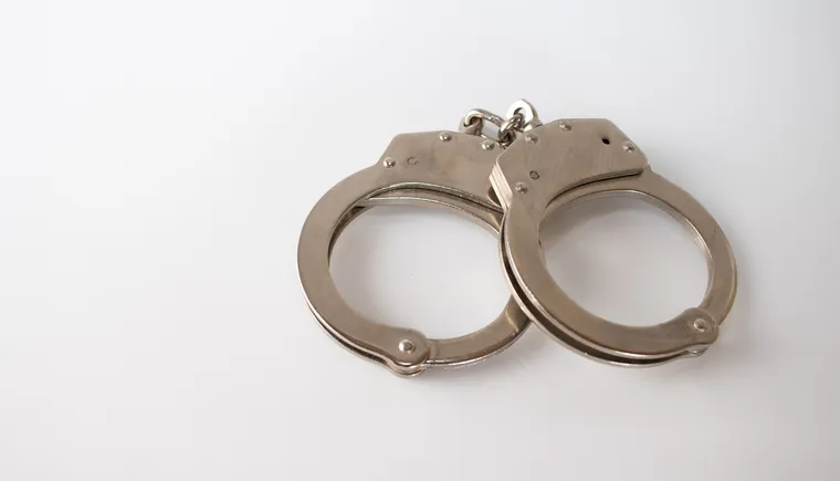 https://ognikubani.ru/wp-content/uploads/2023/03/high-angle-shot-of-metal-handcuffs-isolated