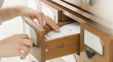 https://ognikubani.ru/wp-content/uploads/2023/01/crop-hands-searching-card-in-drawer