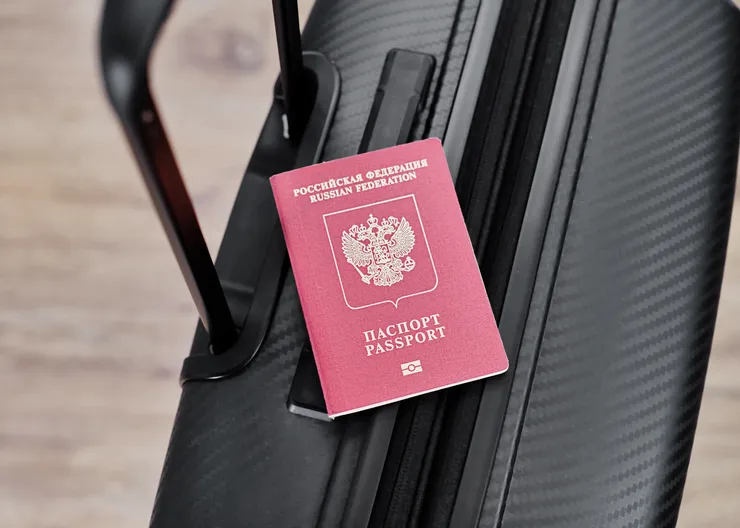 russian-passport-black-travel-suitcase-top-view-selective-background-emigration-russians-seeking-asylum