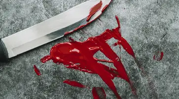knife-smeared-out-artificial-blood-stone-surface