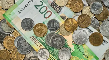 https://ognikubani.ru/wp-content/uploads/2023/03/money-coins-and-banknotes-in-russian-rubles-scattered-in-a-heap-on-the-table-top-view-idea-for-background-or-banner-for-market-news