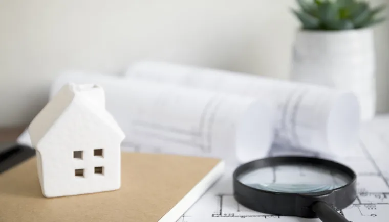 https://ognikubani.ru/wp-content/uploads/2023/01/house-and-notebook-near-magnifying-glass-and-drafts_1
