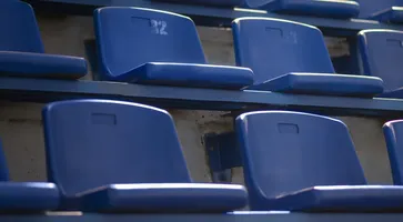 empty-blue-grandstands-low-angle