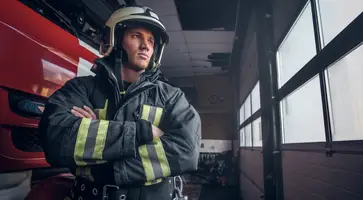 https://ognikubani.ru/wp-content/uploads/2023/01/a-brave-fireman-wearing-protective-uniform-standing-next-to-a-fire-engine-in-a-garage-of-a-fire-department-crossed-arms-and-looking-sideways