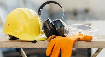 front-view-of-protective-glasses-with-hard-hat-and-headphones