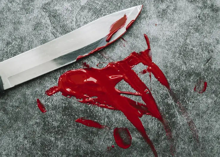 knife-smeared-out-artificial-blood-stone-surface