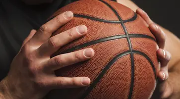 https://ognikubani.ru/wp-content/uploads/2023/01/close-up-of-hand-held-basketball