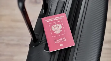 russian-passport-black-travel-suitcase-top-view-selective-background-emigration-russians-seeking-asylum