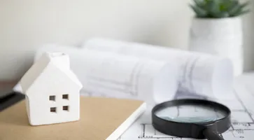 https://ognikubani.ru/wp-content/uploads/2023/01/house-and-notebook-near-magnifying-glass-and-drafts_1