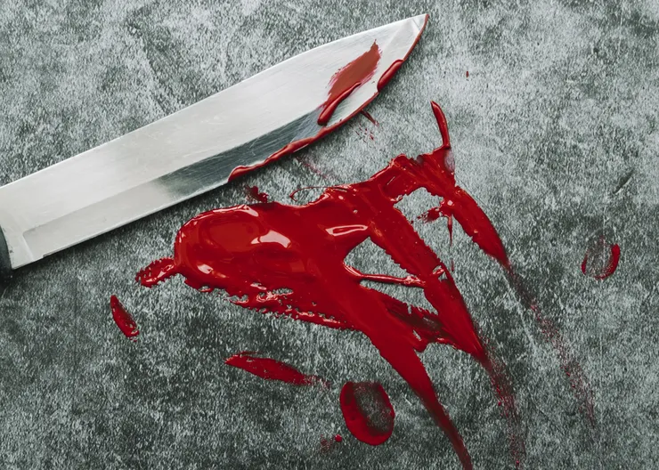 knife-smeared-out-artificial-blood-stone-surface