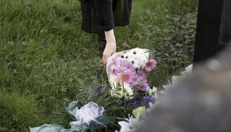 https://ognikubani.ru/wp-content/uploads/2023/03/close-up-flowers-placed-on-the-grave-of-loved-one